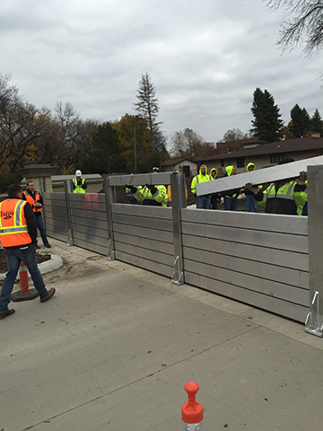 City of Fargo Employees and Contractor's with Reiner assemble the deployable stop logs for the road closure section of El Zagal Floodwall in less than 20 minutes. This flood fighting solution is quick, relyable and much more aesthetically pleasing for any park or cityscape than dirt dikes and sand bags.